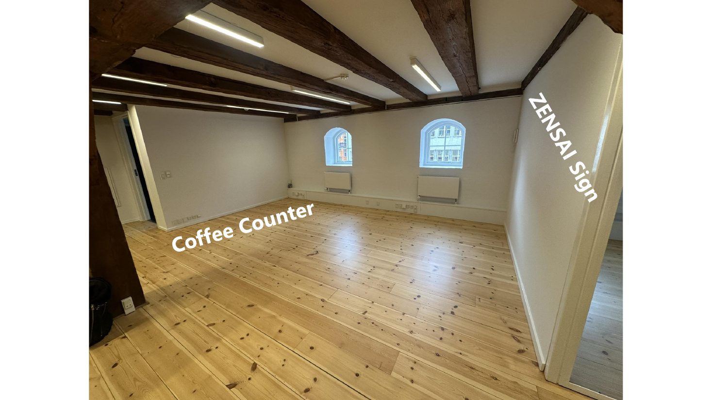 Unfurnished interior: Coffee counter and Zensai sign wall